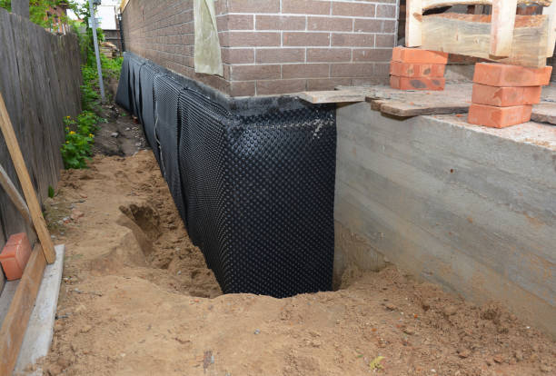 SJ Waterproofing Pros technician performing targeted Basement Waterproofing assessment in Walkerville, MI